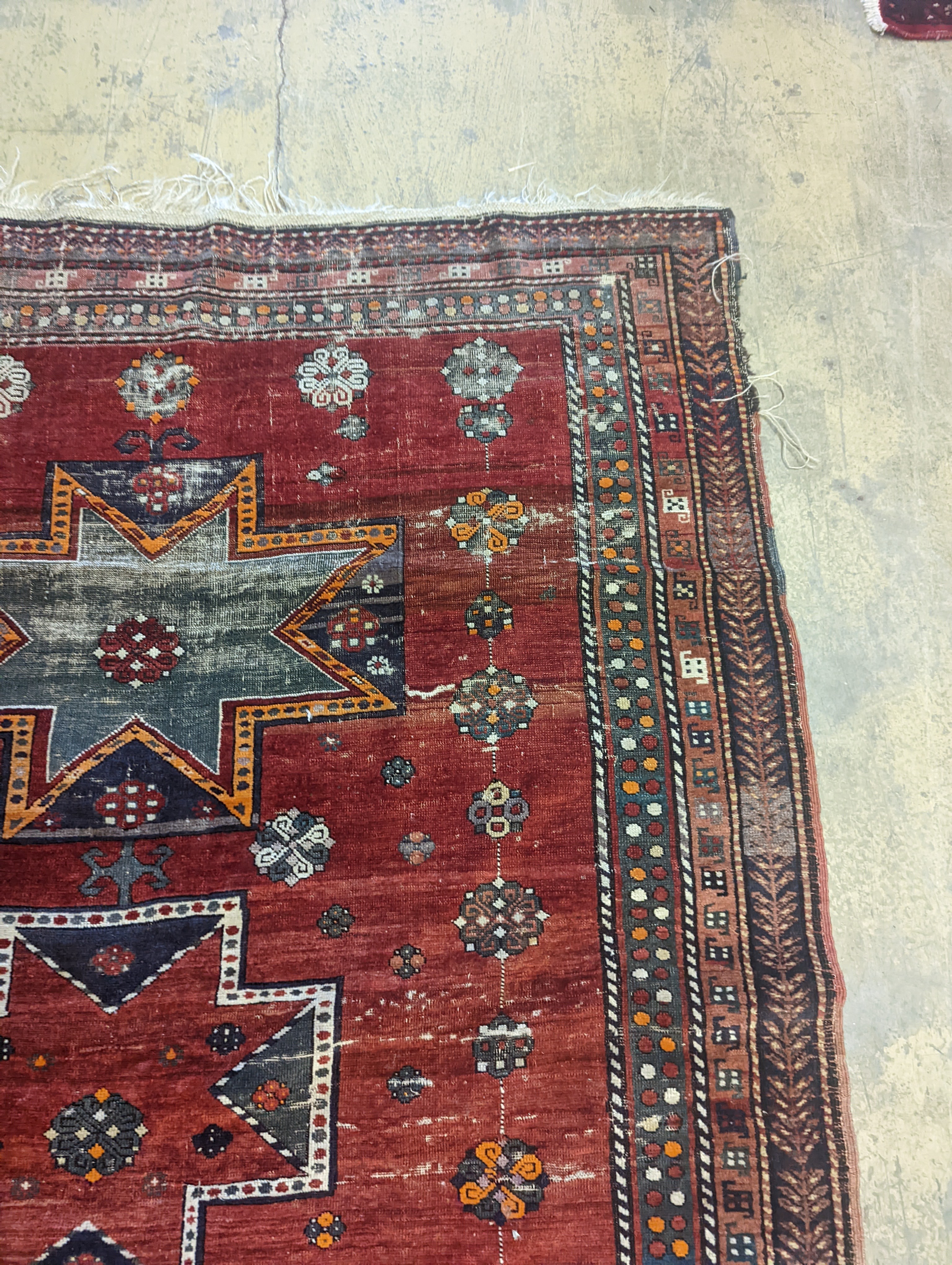 A Kazak red ground rug, 210 x 160cm